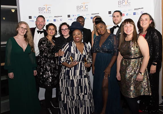 A group of people celebrating award wins at the Black Professionals in Construction Awards 2021