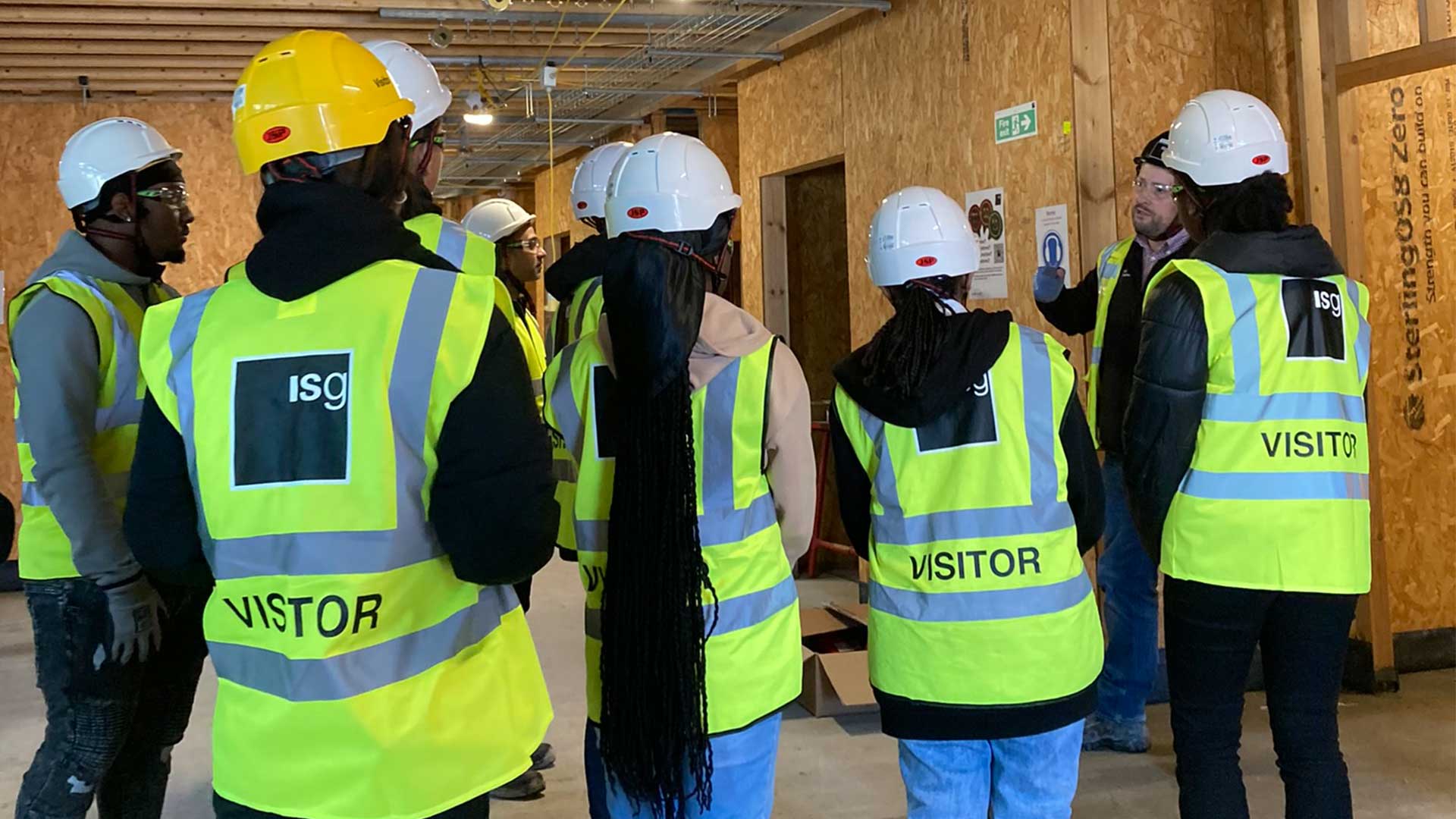 Students taking a tour of a construction site