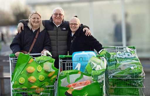 Beneficiaries of Amy's Space with shopping trollies at ASDA