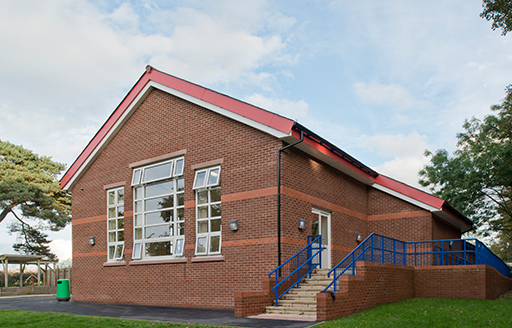 Exterior Aston Primary School dinner hall red brick building with stairs