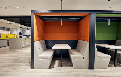 Booths with tables at corporate office for energy client fit out by ISG Ltd