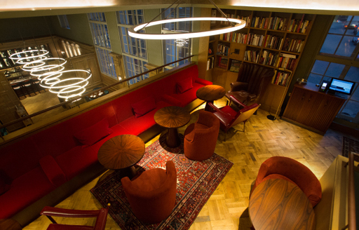 Reading area with plush red velvet chairs at 67 Pall Mall London fit out and restored by ISG Ltd