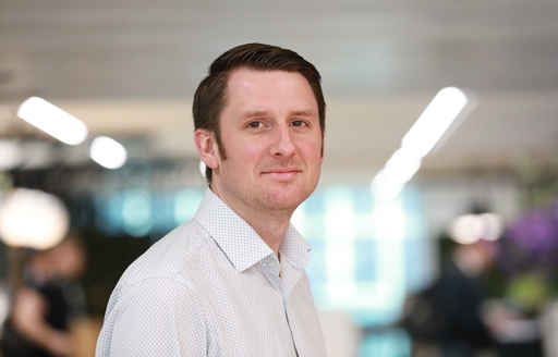 ISG Sustainability head Ross wood headshot in an ISG office