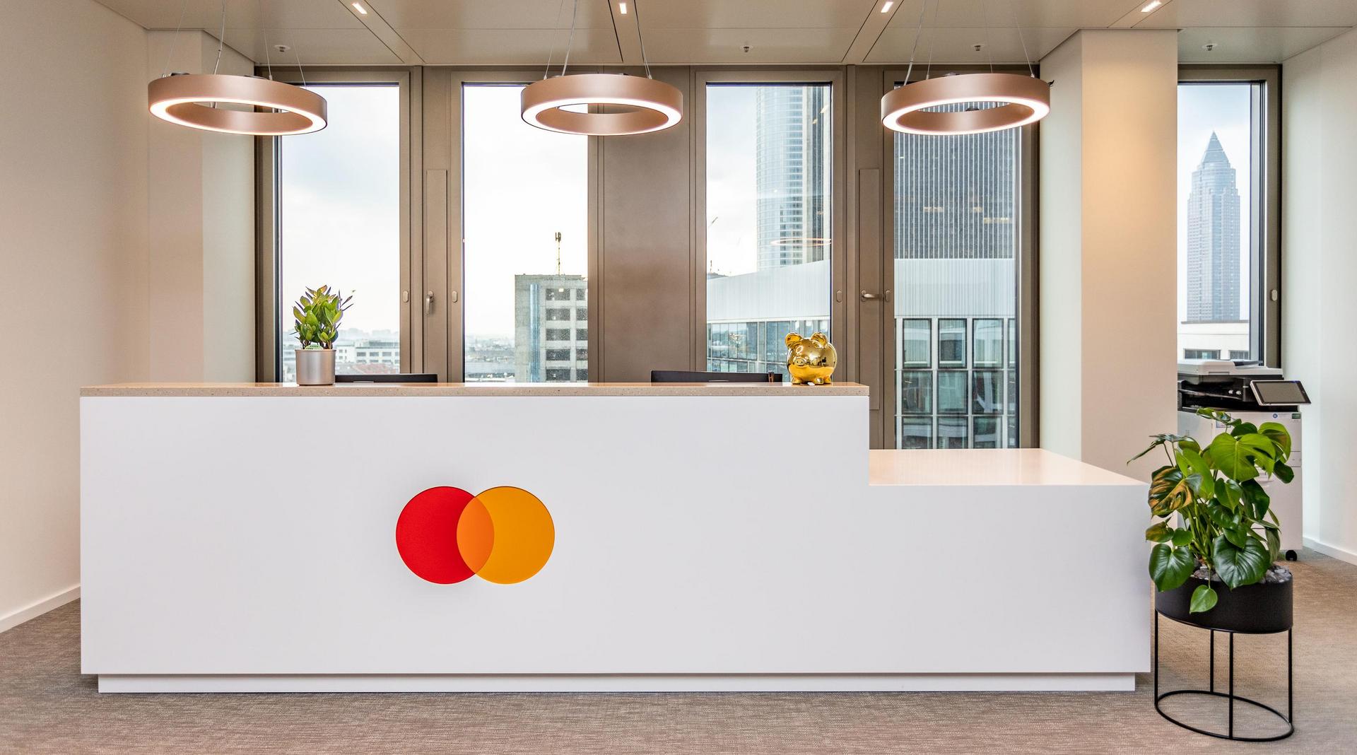 Reception desk with logo at mastercard frankfurt fit out by ISG Germany