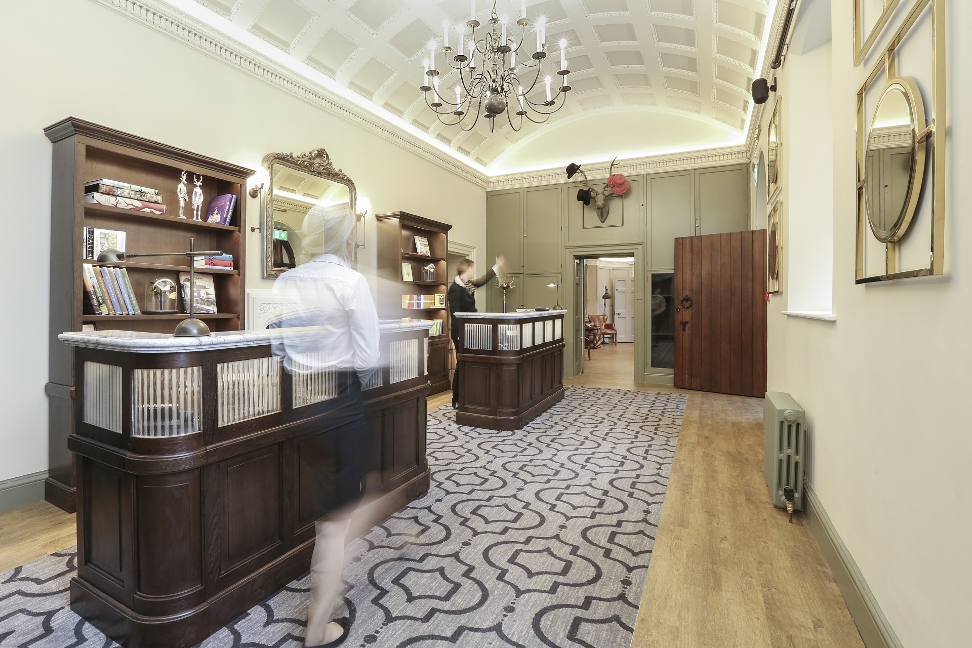 Hotel lobby with concierge in motion at Wotton House, Surrey refurbished by ISG