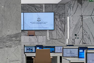 Screens in a conference room with marble walls ISG fit out UAE