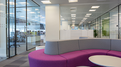 Sofa and coffee table area in office at The Whitechapel Building fit out by ISG