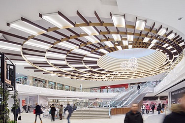 Central atrium with escalators and crowds at Manchester Arndale Shopping centre retail fit out by ISG UK Ltd