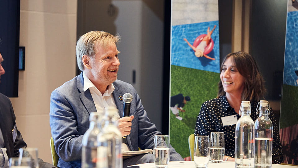 Arup's Tim Chapman and ISG's Zoe Price speaking at a conference