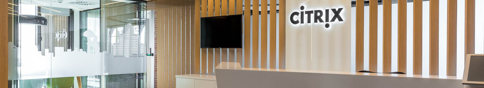 Banner image Citrix Systems office showing glass panels with skyline transfer and wooden slated reception area with company logo