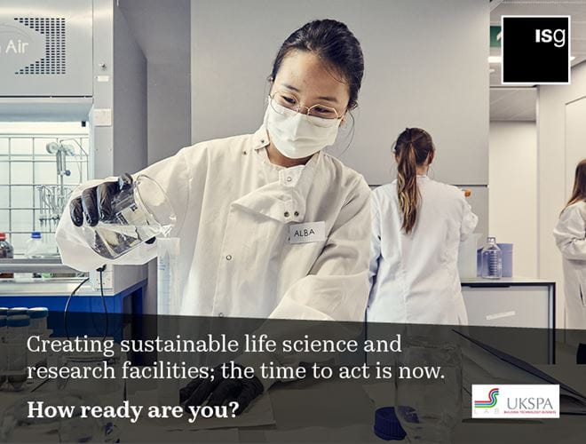 Photo of woman in a science laboratory advertising ISG Sustainable Buildings Monitor UKSPA webinar