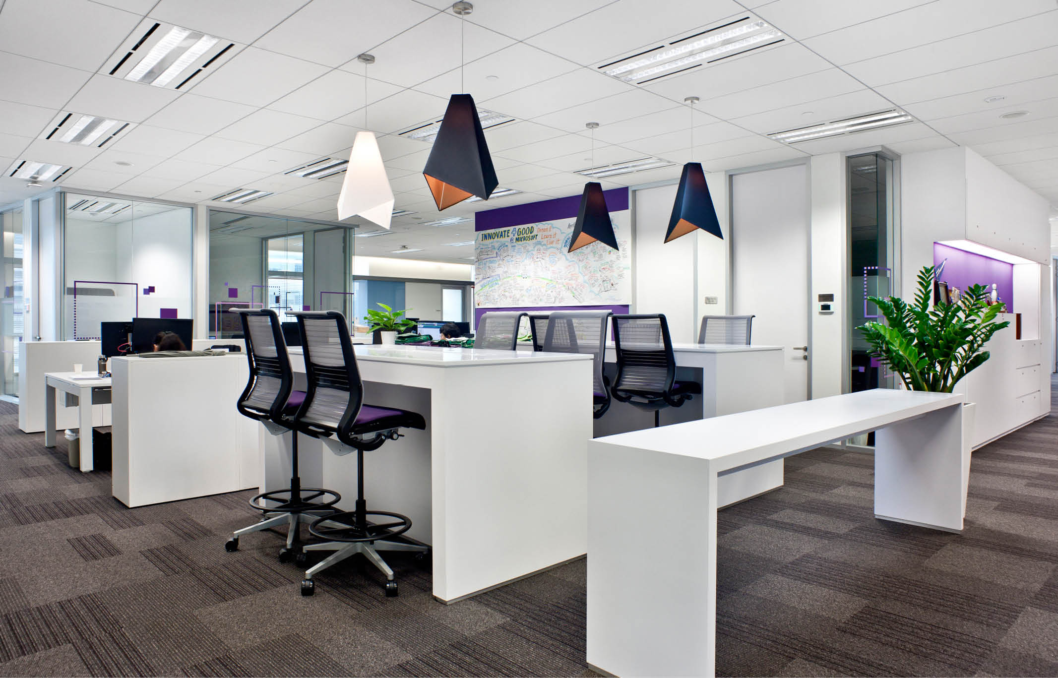 High tables with office chairs at Microsoft office Singapore fit out by ISG Ltd