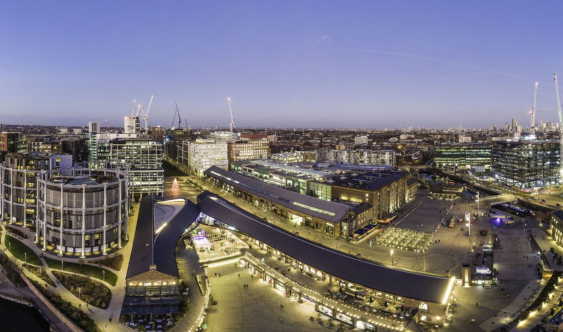Aerial view of Kings Cross redevelopment Granary Square Coal Drops Yard in late evening