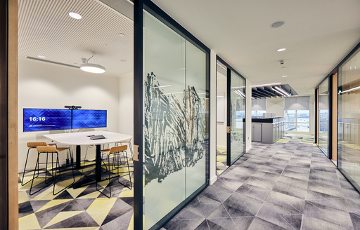 Corridor with meeting rooms at corporate office of energy client fit out by ISG Ltd