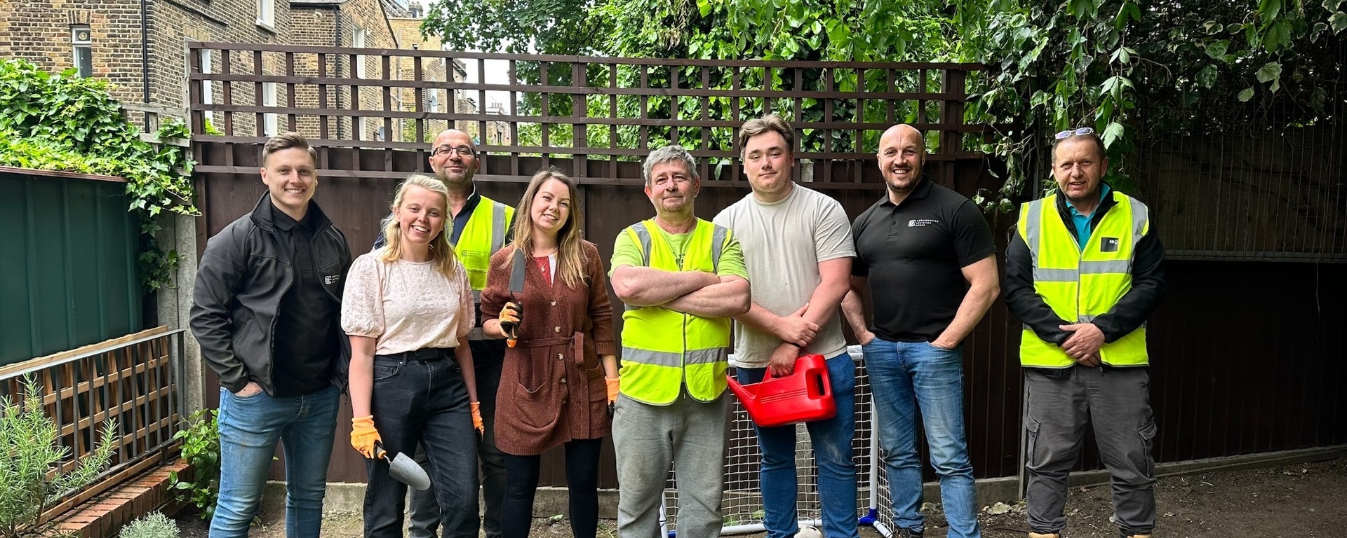 Group of ISG social value employees volunteering in a community garden