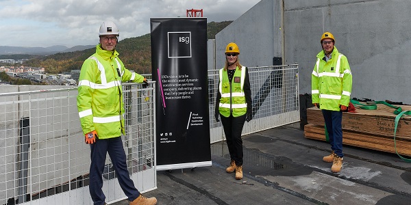 Diana Nagle from Fusion Students, Rob Stewart from Swansea Council and Ian Packer from ISG celebrate at ceremonial topping out